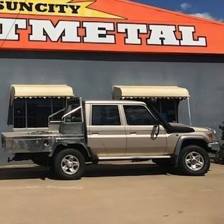 A Pickup Truck is Parked in Front of a Building — Sun City Sheetmetal In Garbutt, QLD