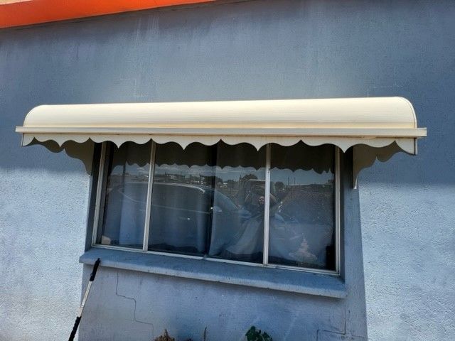 A window with a white awning over it— Sun City Sheetmetal In Garbutt, QLD