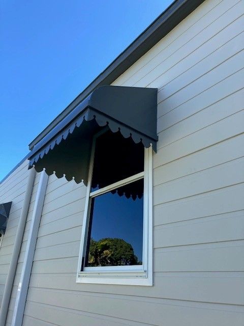 A window on a house with a canopy over it— Sun City Sheetmetal In Garbutt, QLD