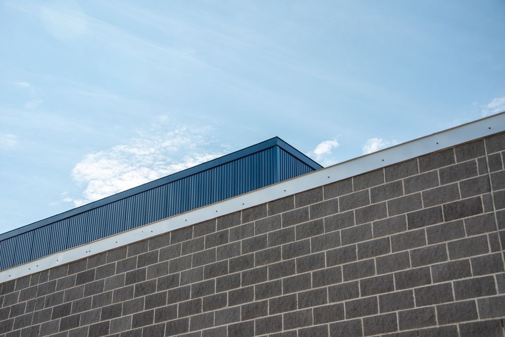 A House With a Brown Roof and Two Skylights on the Roof — Sun City Sheetmetal In Garbutt, QLD