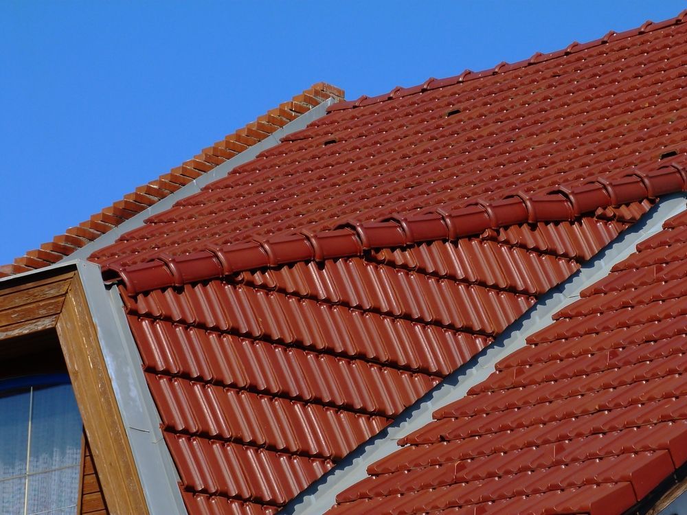 A Building With a Gray Roof and White Siding — Sun City Sheetmetal In Garbutt, QLD