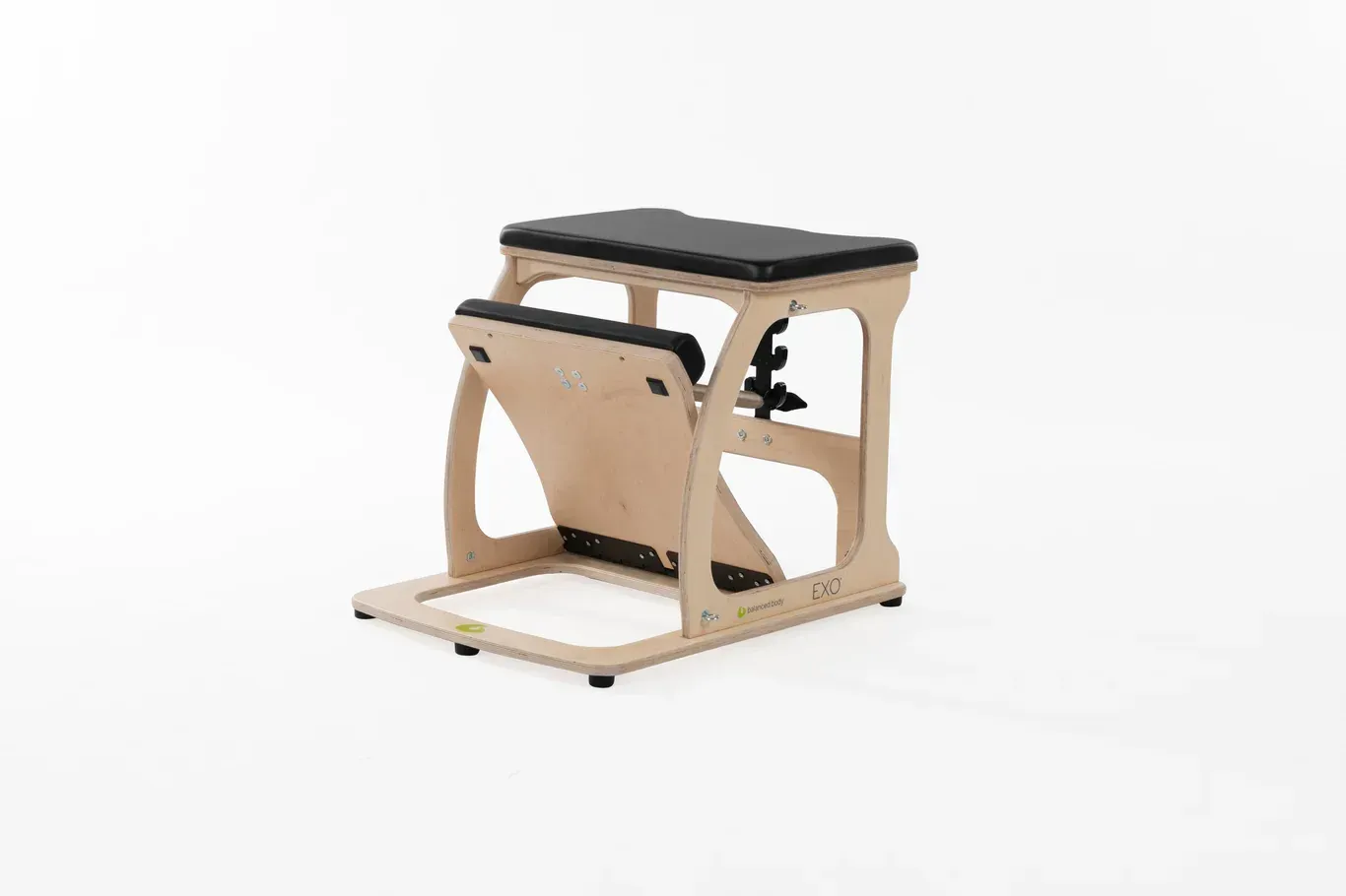 Wooden Pilates chair with black seat and pedal