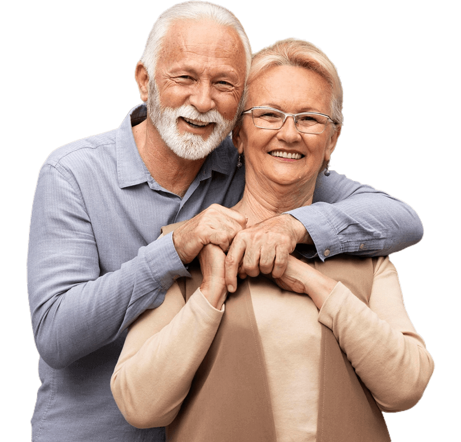 A man and a woman are hugging each other and smiling.