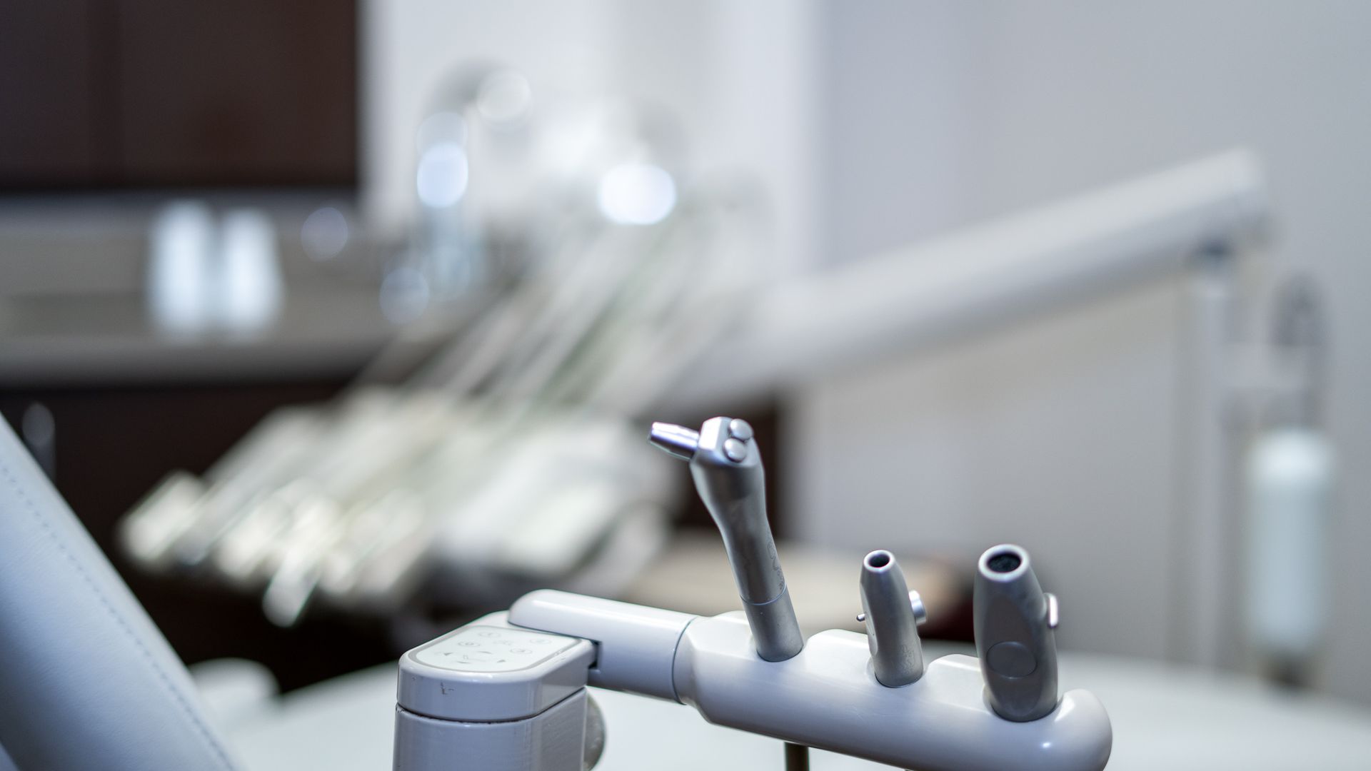 A close up of a dental chair in a dental office.