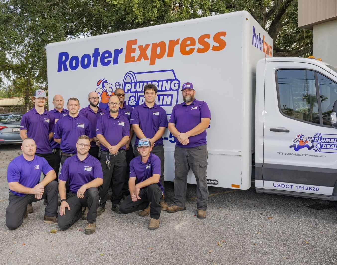 Four Men Behind Rooter Express Truck — Brunswick, GA — Rooter Express Plumbing & Drain