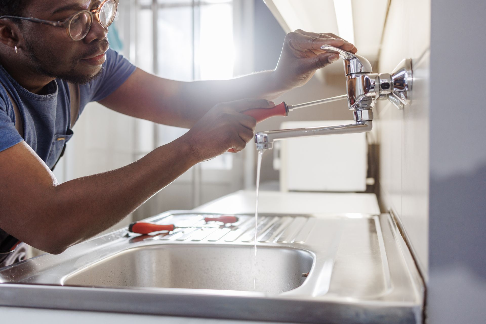 Plumber Fixing Sink Pipe — Brunswick, GA — Rooter Express Plumbing & Drain