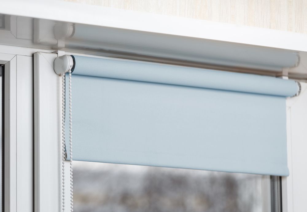 A Close Up Of A Roller Blind On A Window — Gaeta's Upholstery Blinds & Awnings in Casino, NSW
