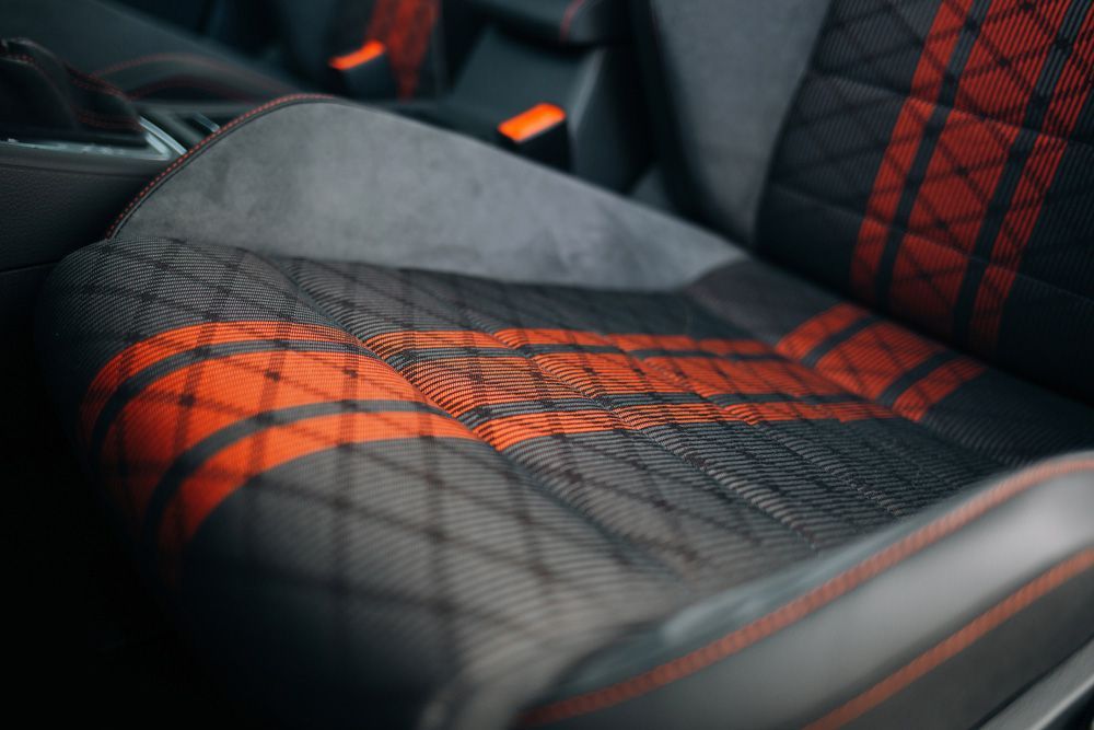 A Close Up Of A Car Seat With Red Stripes— Gaeta's Upholstery Blinds & Awnings in Grafton, NSW