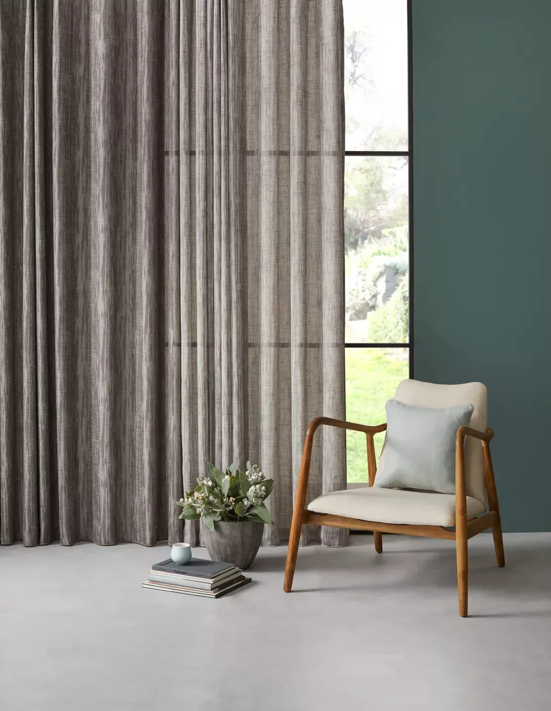 A Woman Is Standing On A Ladder Cleaning Curtains In A Bedroom — Gaeta's Upholstery Blinds & Awnings in Grafton, NSW