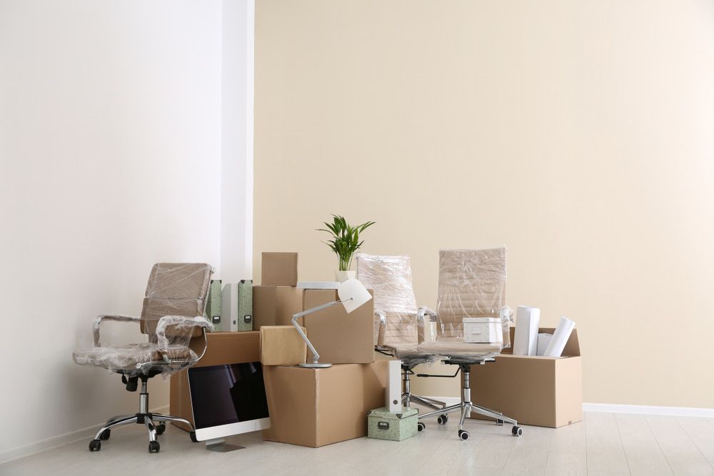 Office With Two Plastic-covered Chairs — Cairns Mini Movers In Mount Sheridan, QLD