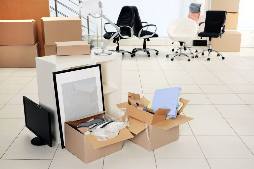 Office With Boxes and Office Supplies Scattered — Cairns Mini Movers In Mount Sheridan, QLD