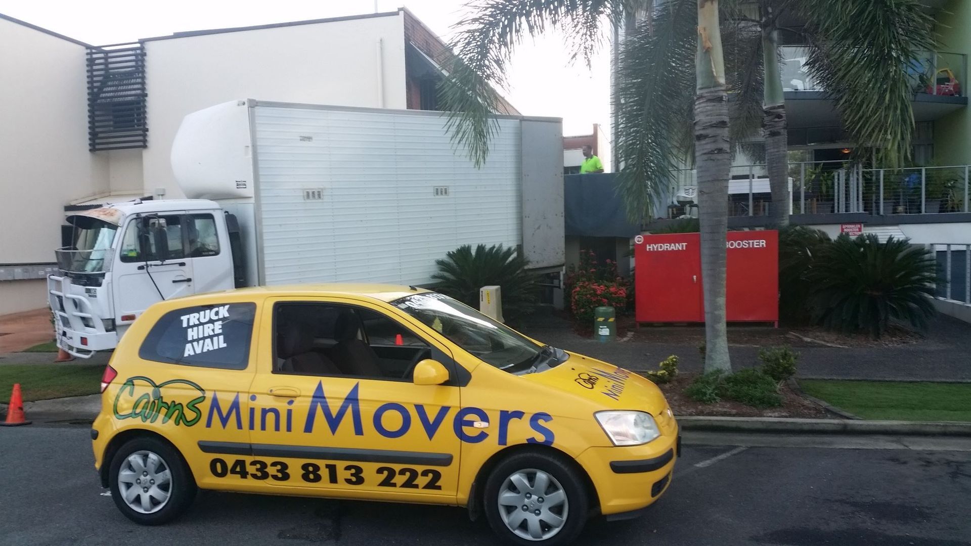 Yellow Cairns Mini Movers Car With Contact Details 