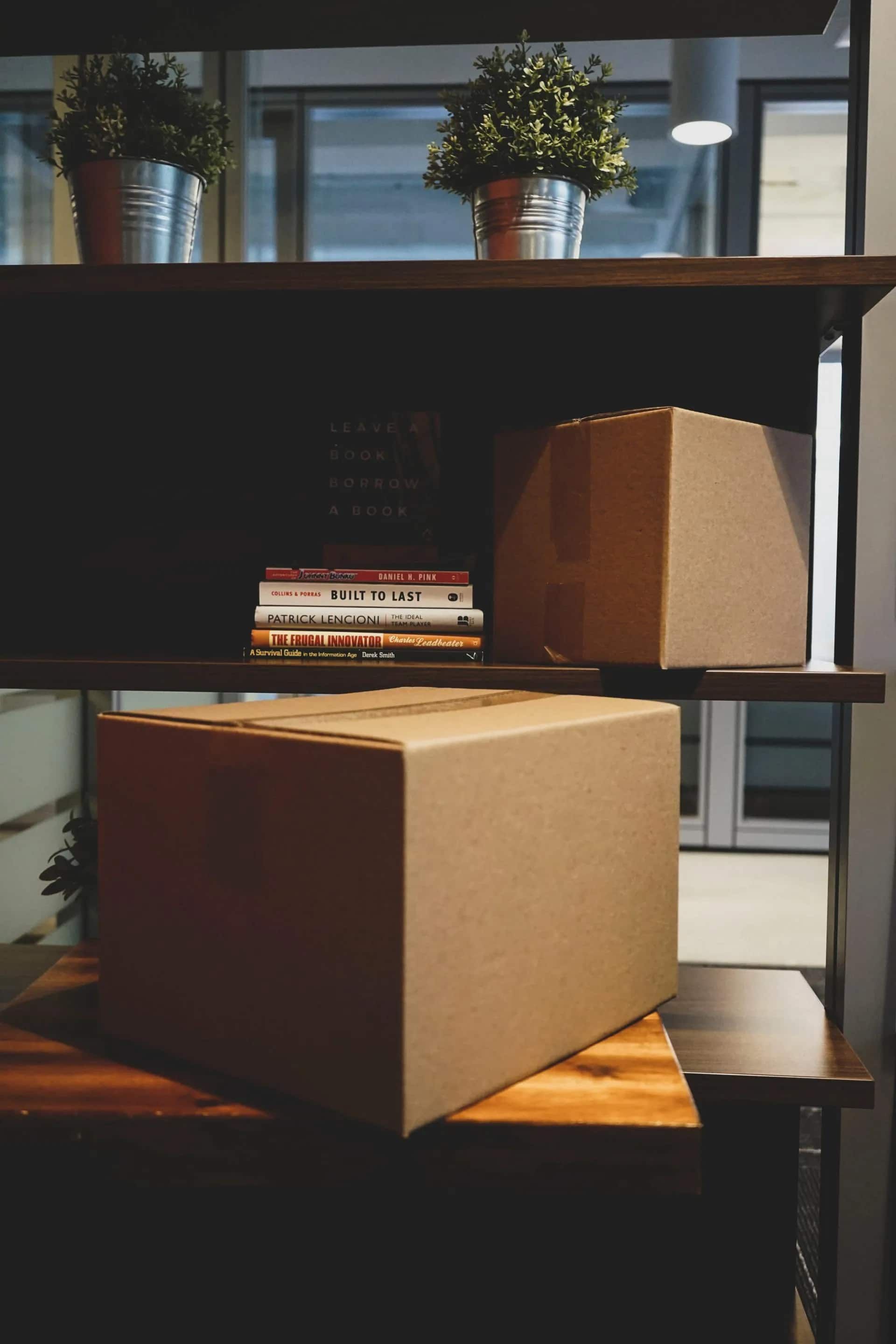 Cardboard Boxes on a Wood Shelf — Cairns Mini Movers In Mount Sheridan, QLD