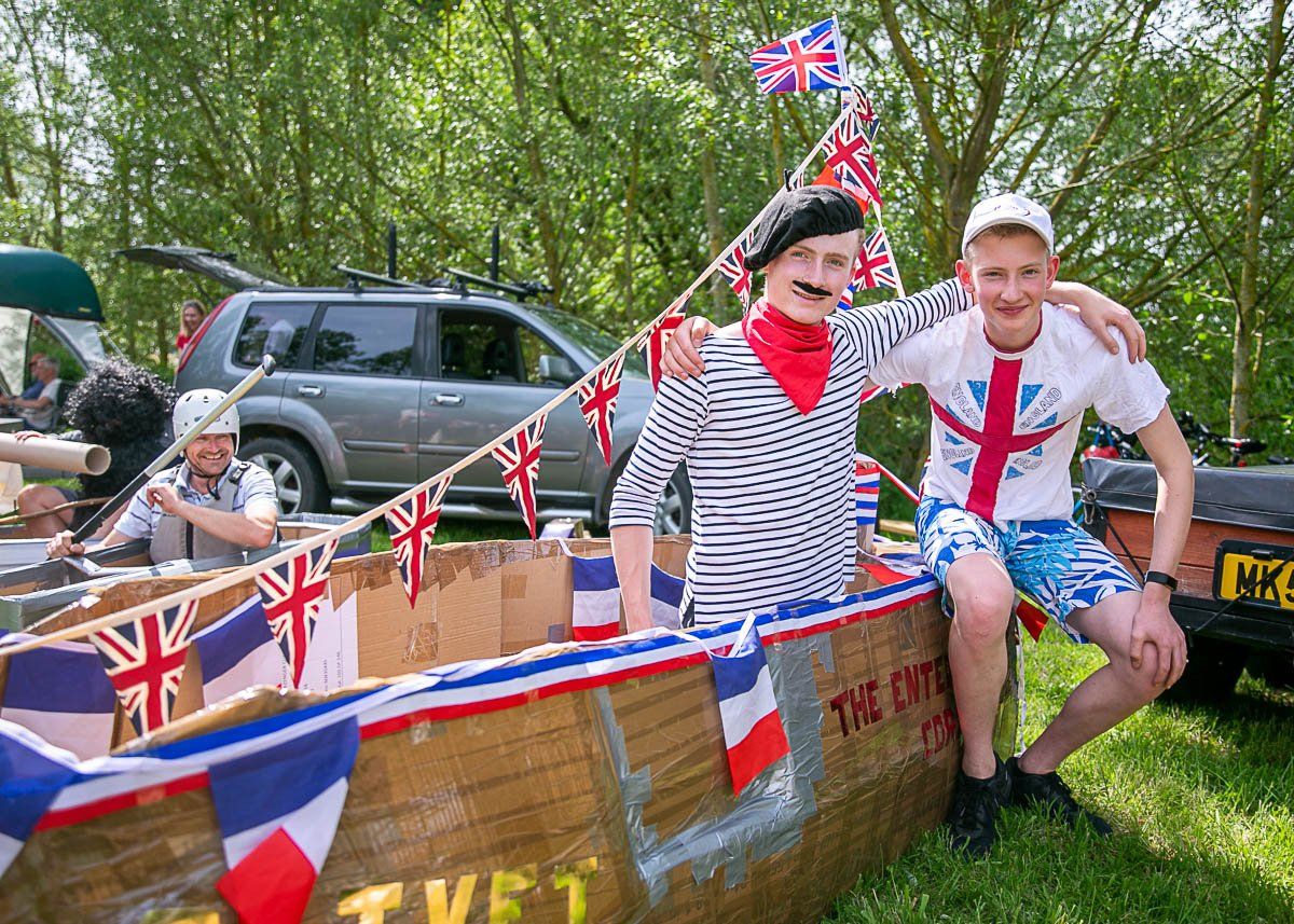 2 people dressed up as sailors in a raft for the Fakenham Raft Race