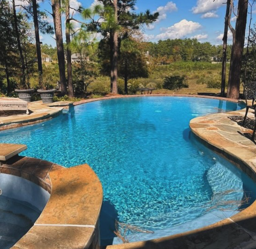 A large swimming pool designed and installed by Carolina Pool Plastering in Pineville, NC