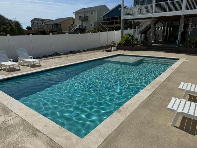 A large swimming pool designed and installed by Carolina Pool Plastering in Pineville, NC
