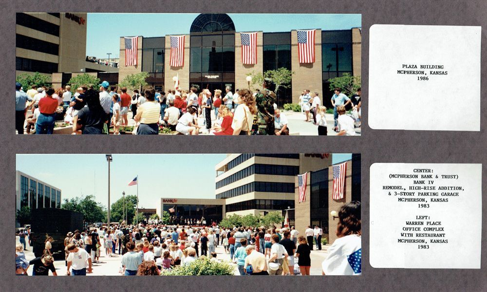 Crowd gathers outside a building with American flags. People are walking, standing, and looking towards the entrance.