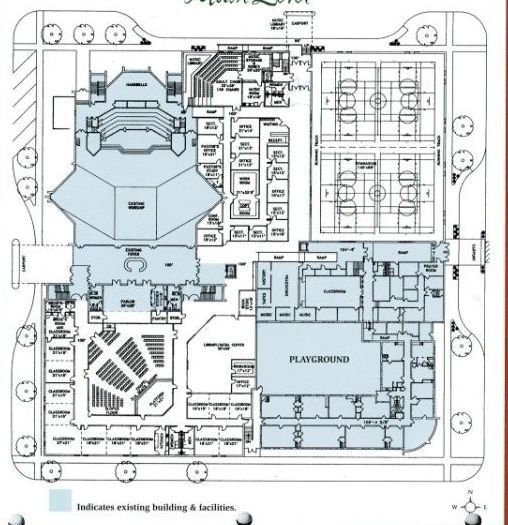 Floor plan of a building with highlighted areas; includes an auditorium, playground, and sports courts.