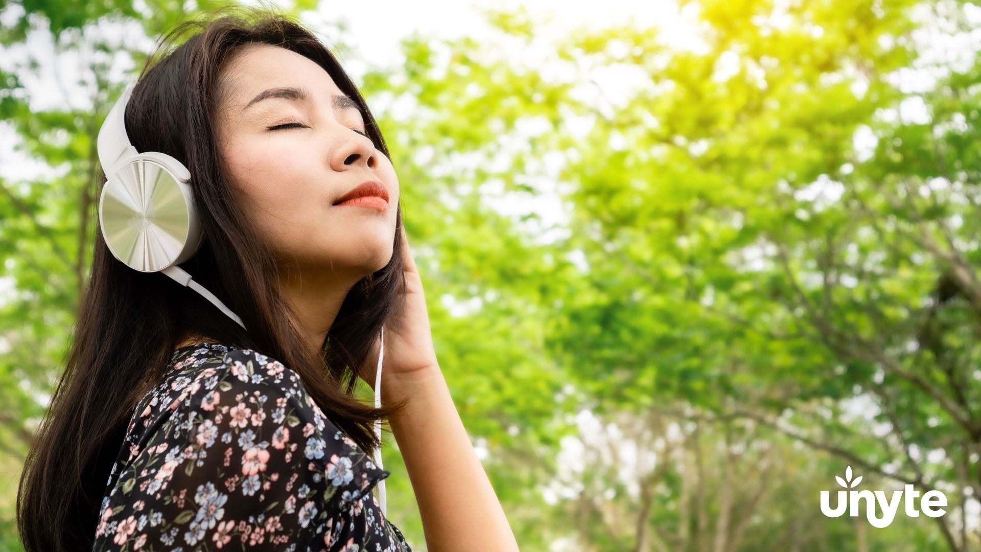 Woman with headphones listening to safe and sound protocol to help with emotion regulation