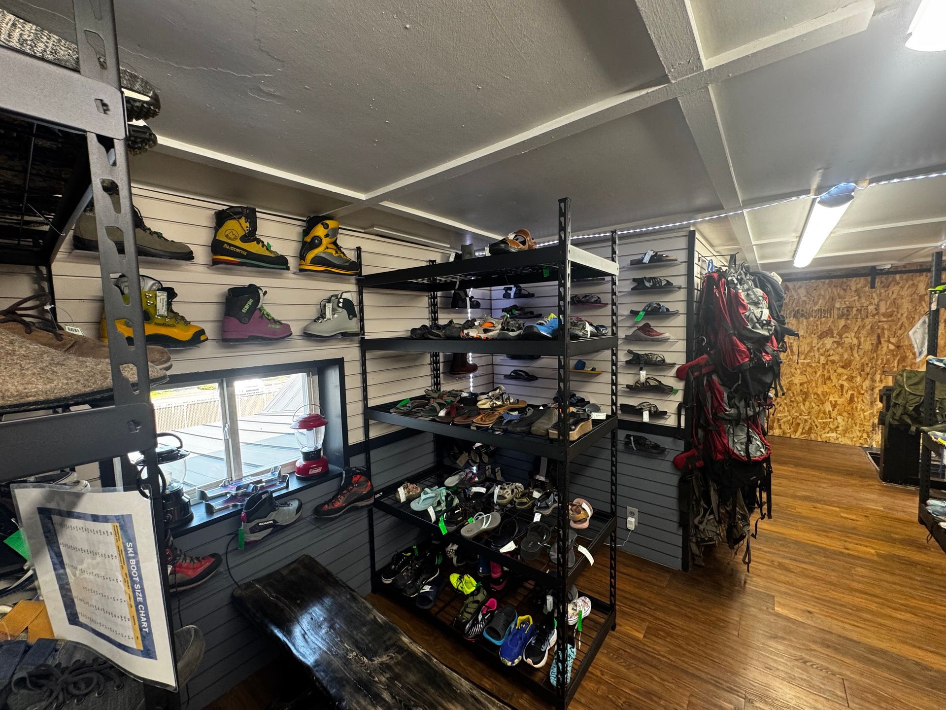 A store filled with lots of shoes on shelves.