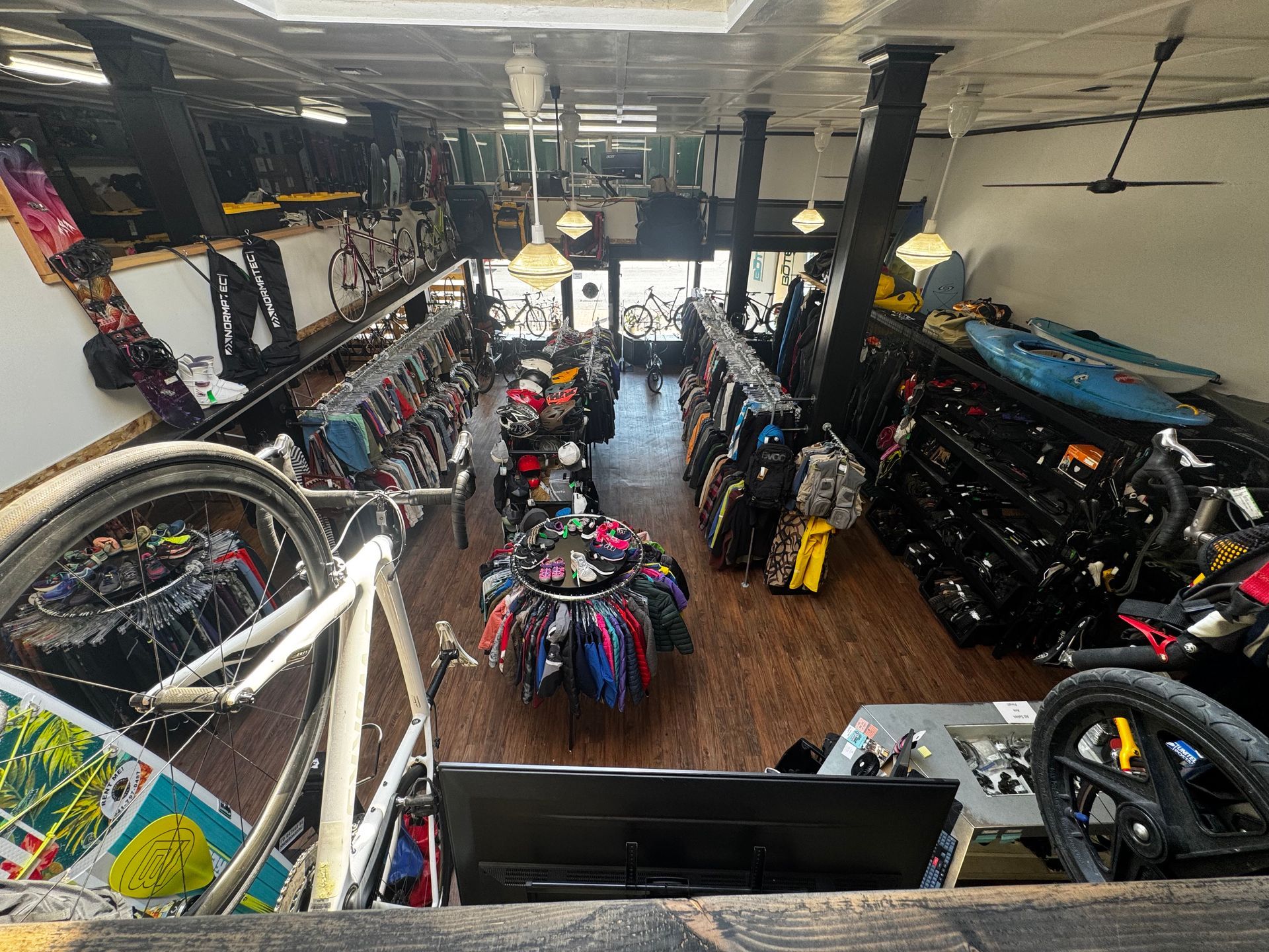 An aerial view of a bicycle shop with a bicycle in the foreground.