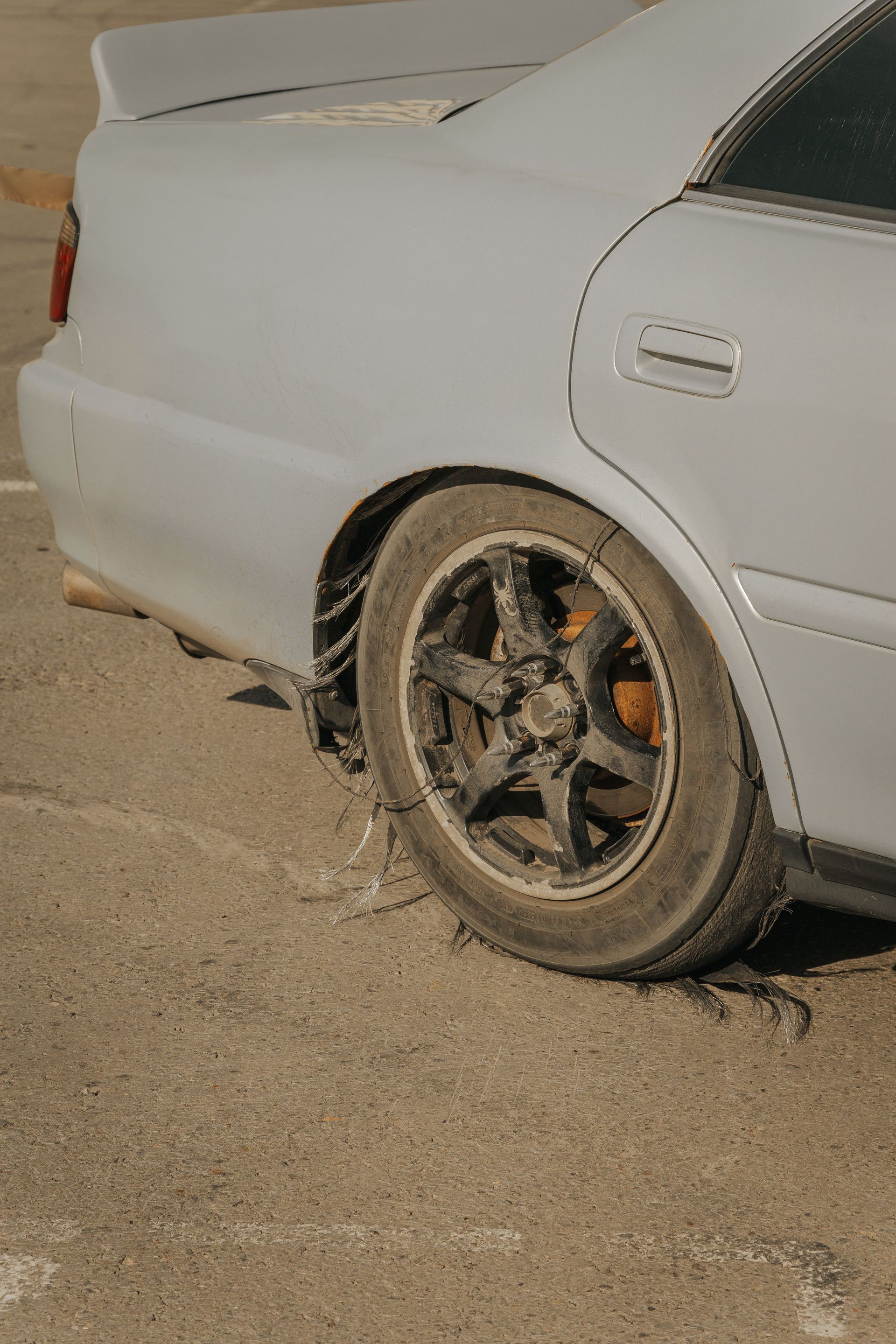 Car tire destroyed by wear and tear