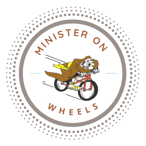 The logo for minister on wheels shows a dog riding a bike.