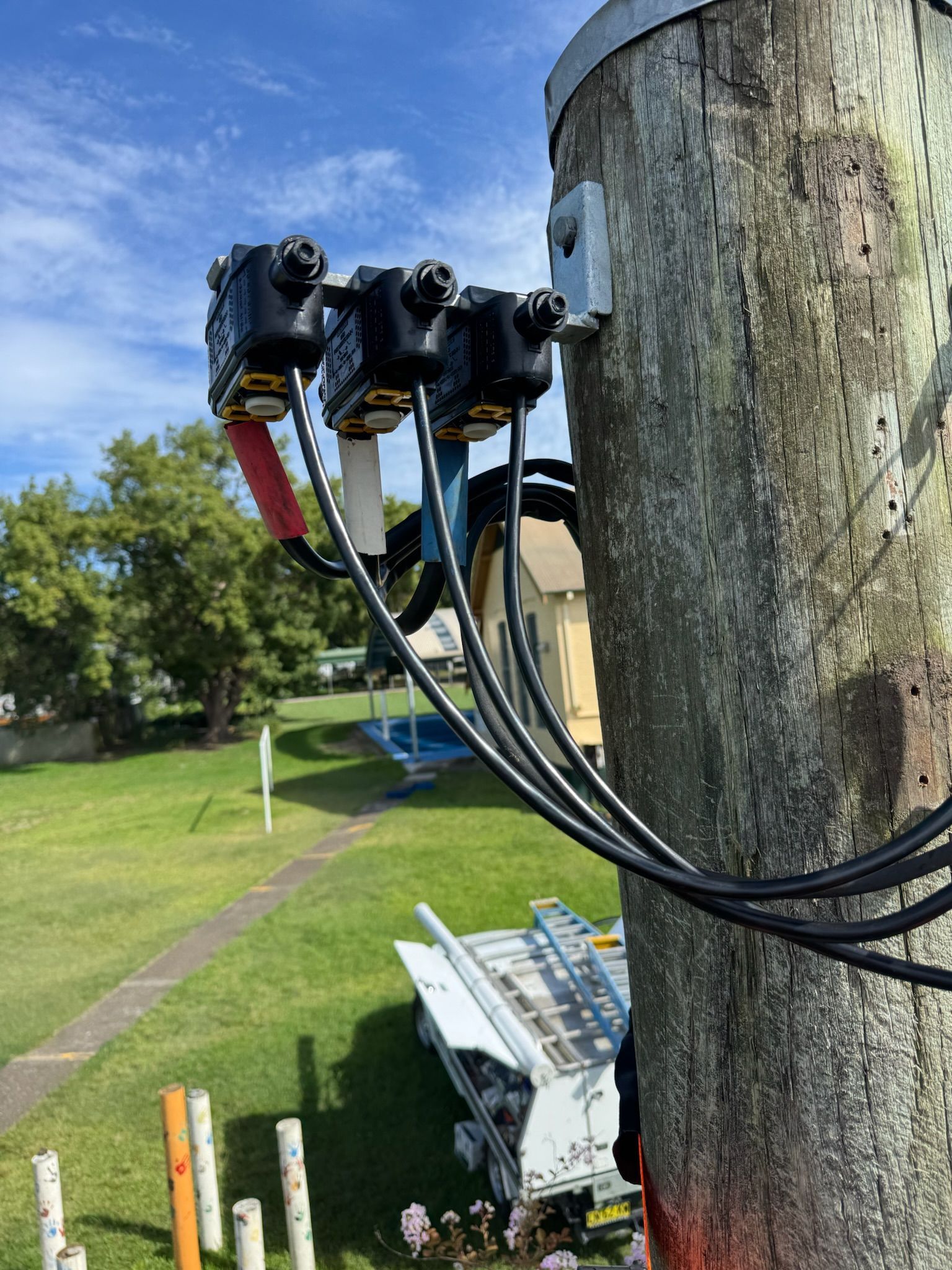 H Igh Voltage Cables on A Pole— DMP Electrical Contractors In Maitland, NSW