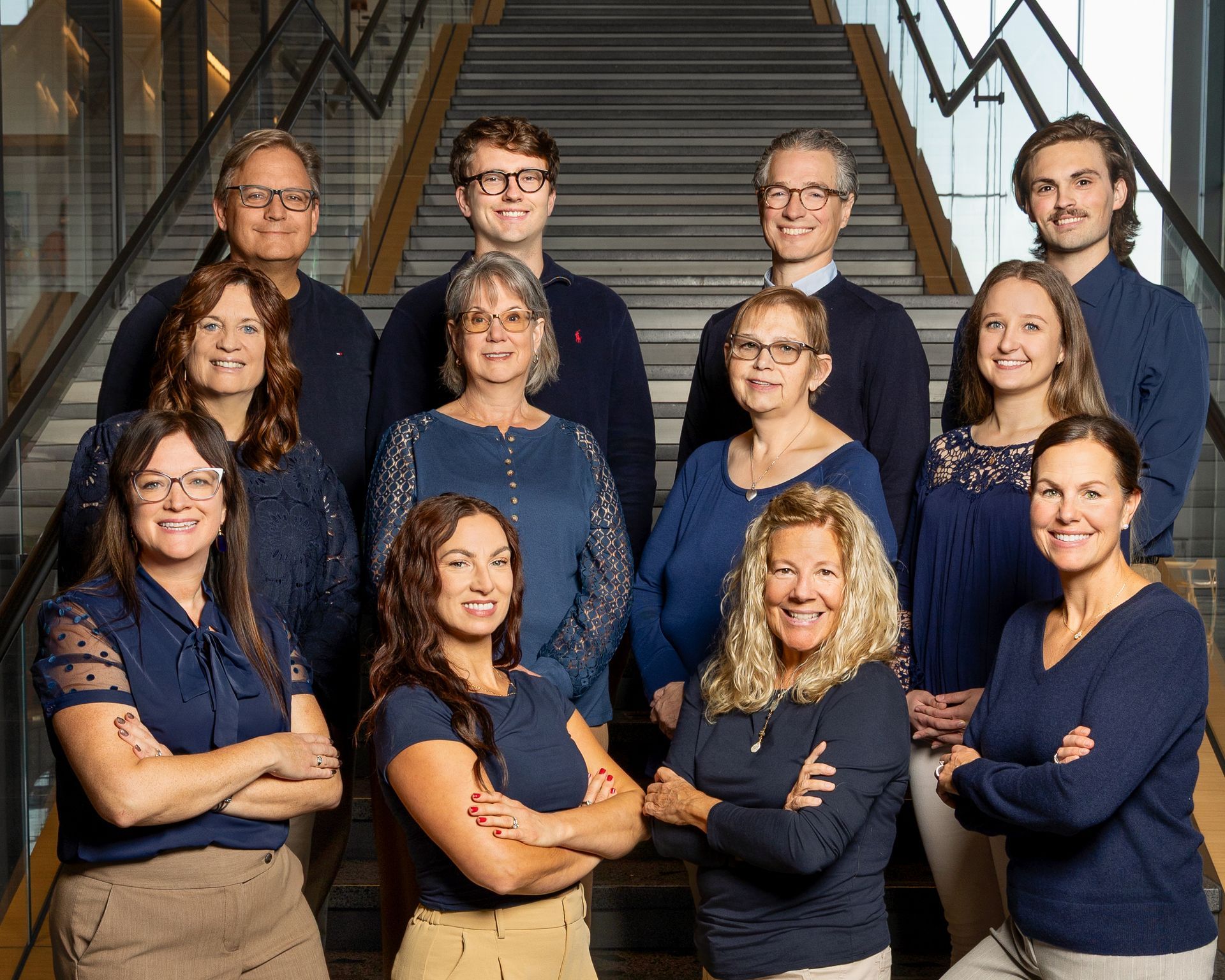Team photo of a law firm with ten people in an office setting.