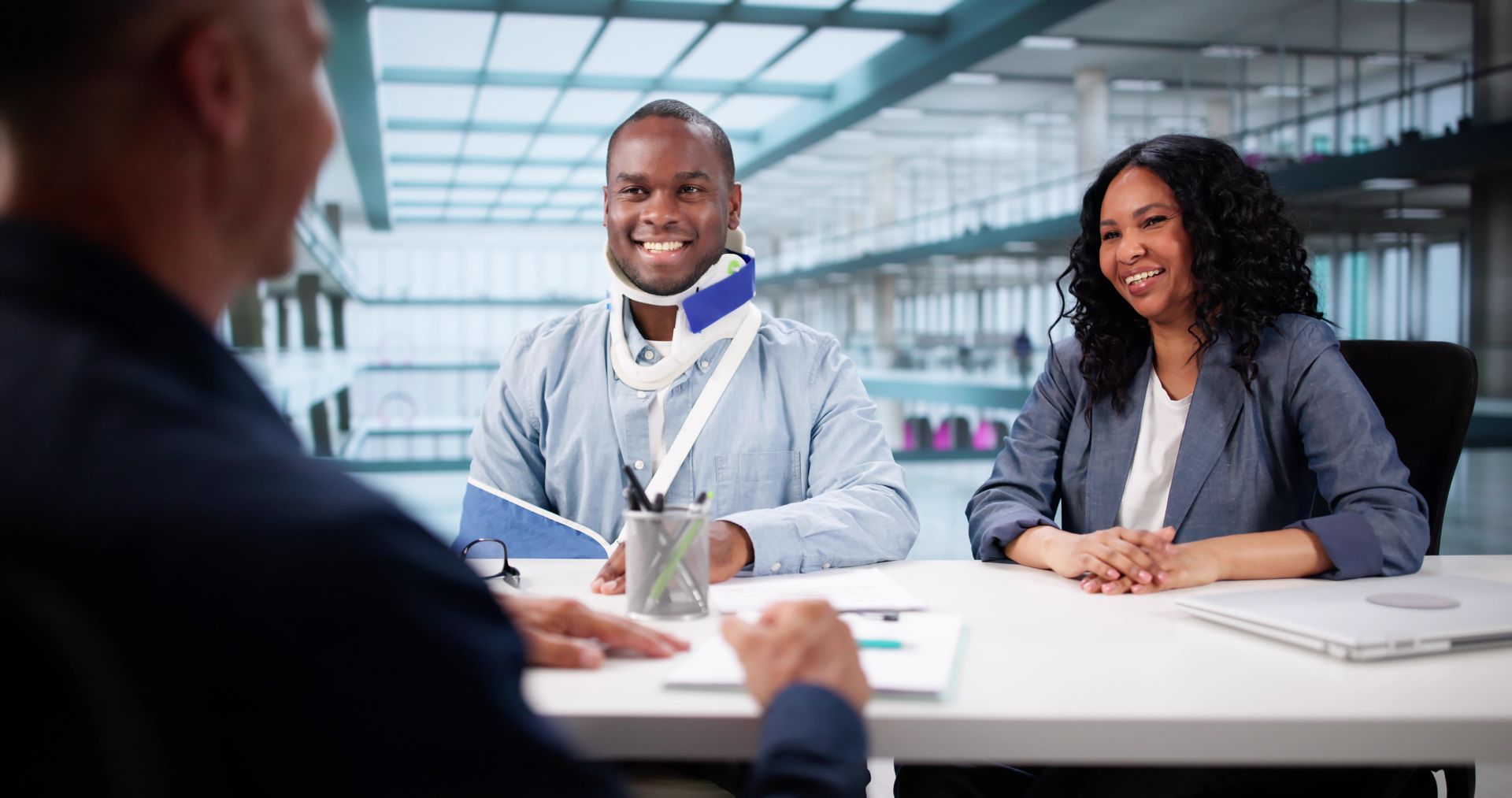 Injured client consulting with a personal injury attorney.