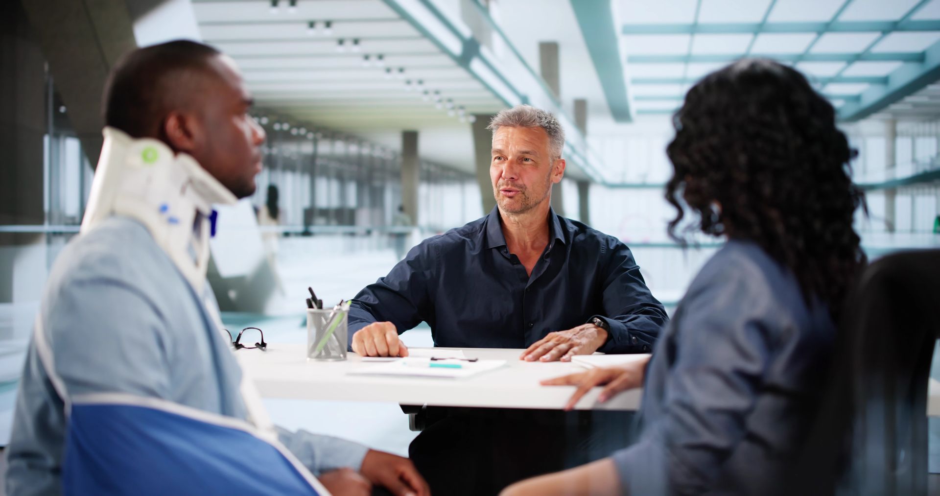 Injured client meeting with personal injury attorney.