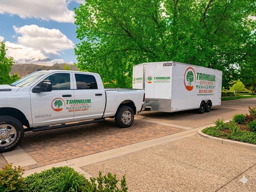 White truck pulling a white trailer with the