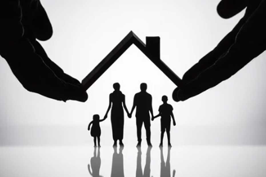 Silhouette of a family under a house-shaped frame, held by hands, symbolizing protection and home.