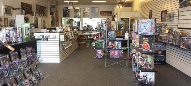 A view inside a hobby shop with shelves of boxed action figures.