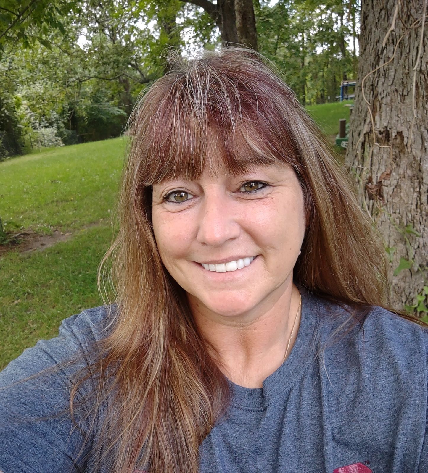 A picture of San Jacinto ESD Manager Denise Lewis in front of a tree in a park.