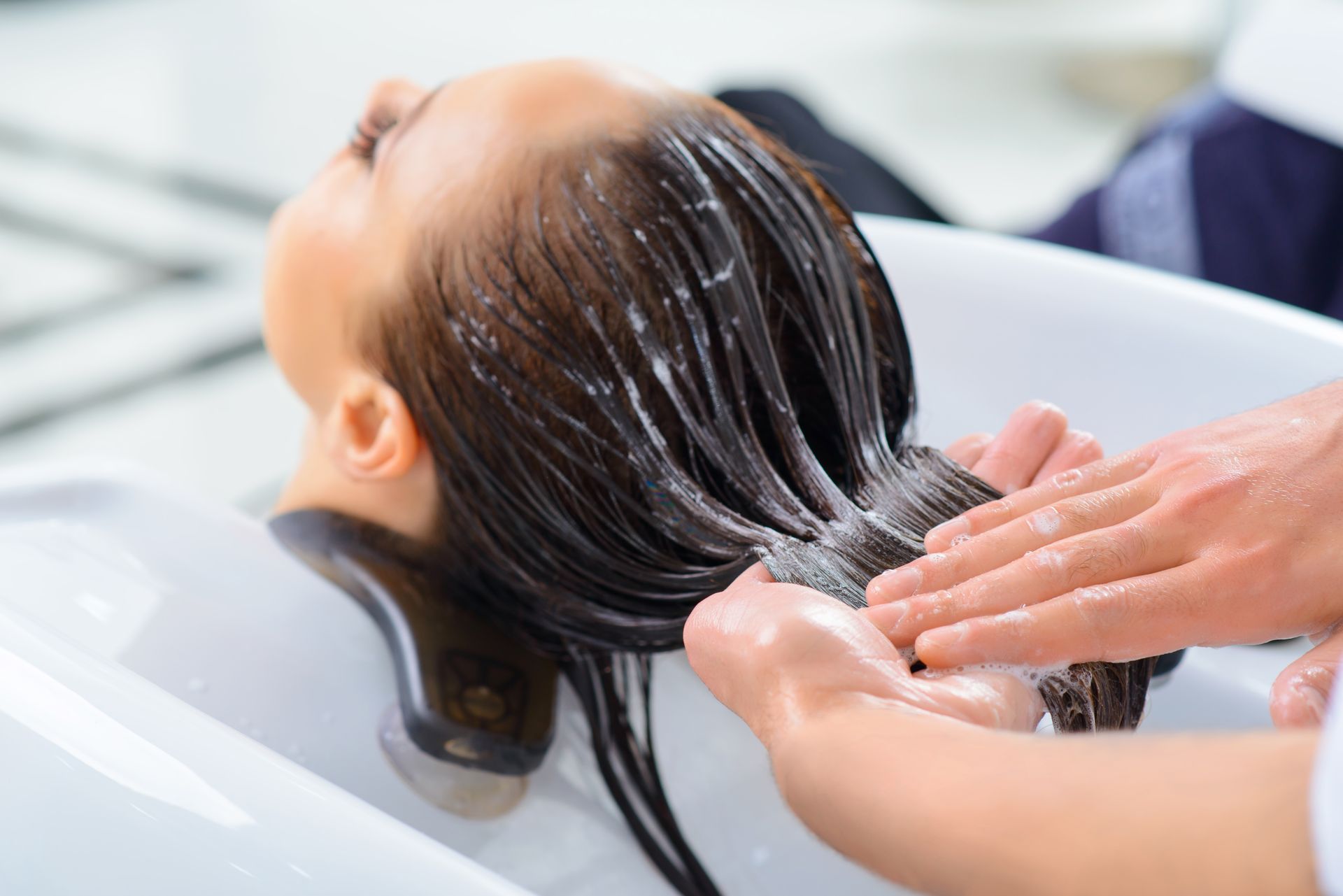 A Woman is Getting Her Eyebrows Waxed in a Beauty Salon