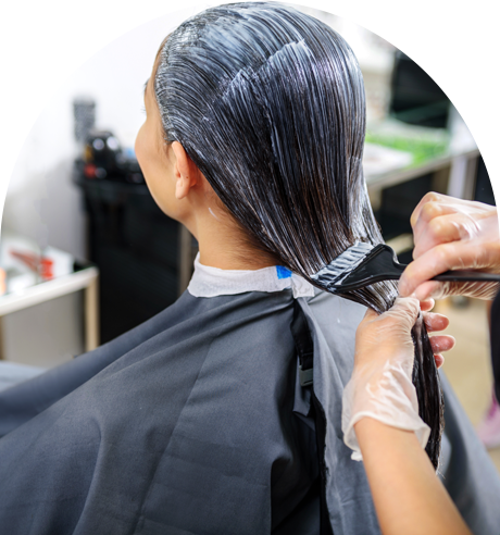 A Woman is Getting Her Hair Dyed in a Salon