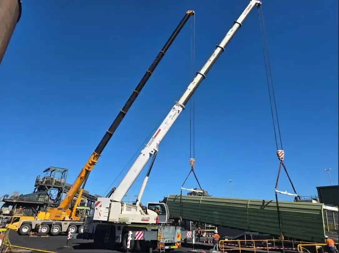 Tow Truck With Extended Boom Lifting a Red Cherry Picker — Kings Cranes in Collinsville, QLD