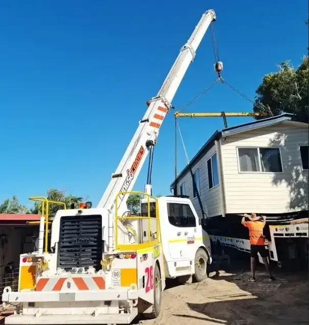 Crane Lifting a White House Module While Workers Guide It on a Sunny Day — Kings Cranes in Gregory River, QLD