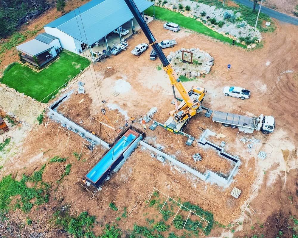 An Aerial View Of A Construction Site With A Crane And A Truck — Dynamic Crane Hire In Capella, QLD