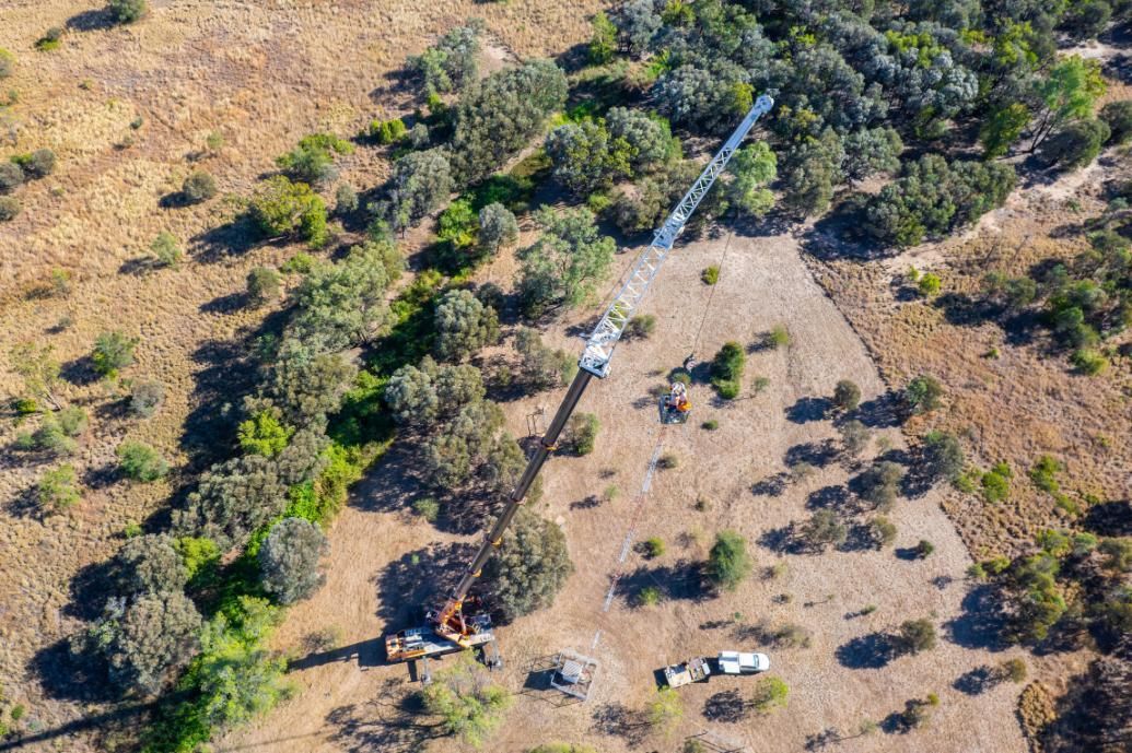 An Aerial View Of A Field With Trees And A Water Pipe — Dynamic Crane Hire In Blackwater, QLD