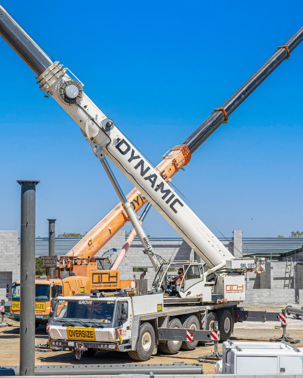 A Dynamic Crane Is Sitting On Top Of A Truck On A Construction Site — Dynamic Crane Hire In Emerald, QLD