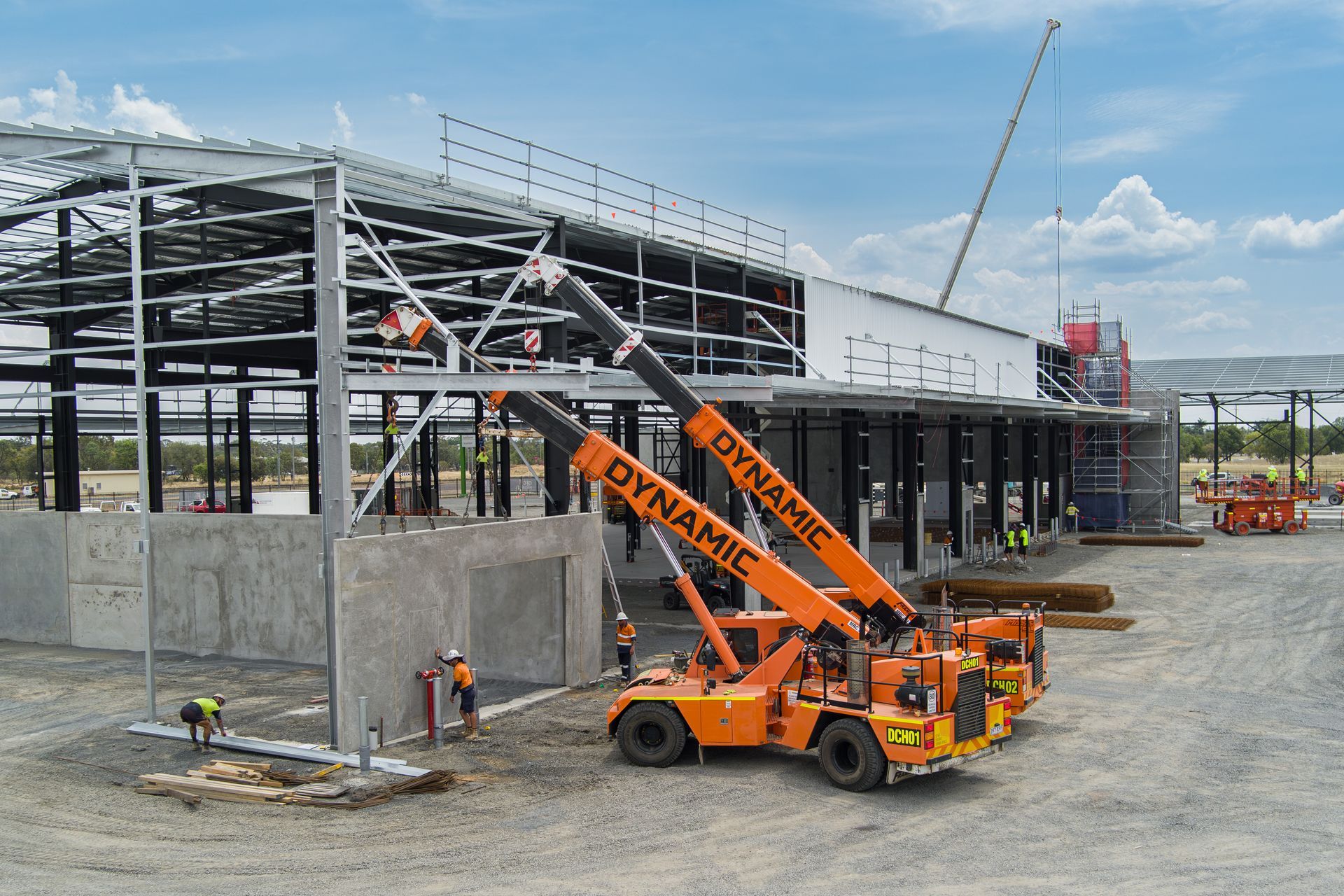 A Construction Site With A Crane That Says Dynamic On It — Dynamic Crane Hire In Emerald, QLD