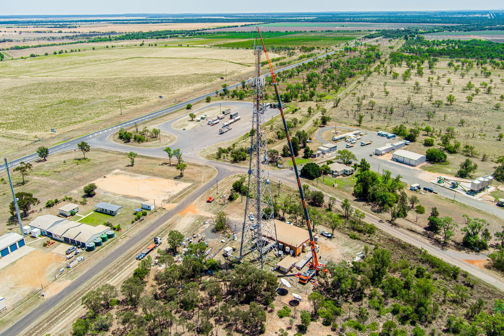 An Aerial View Of A Radio Tower Being Built In The Middle Of A Desert — Dynamic Crane Hire In Emerald, QLD