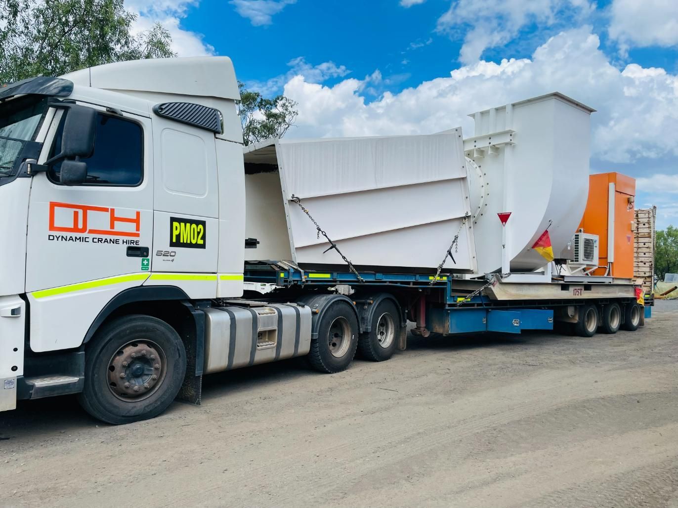 A White Truck With The Number Pw02 On The Side Is Parked In A Parking Lot — Dynamic Crane Hire In Biloela, QLD