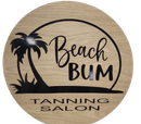 A round, wood-grain sign with a black palm tree silhouette and the text "Beach BUM TANNING SALON."