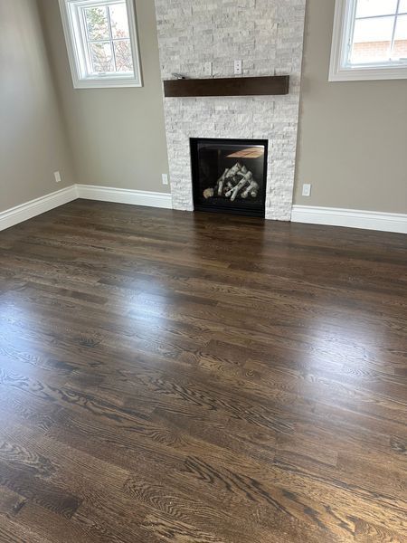 Ceric Hardwood Floors — beautifully refinished hardwood floor in Denver home, rich warm tones restored to like-new condition