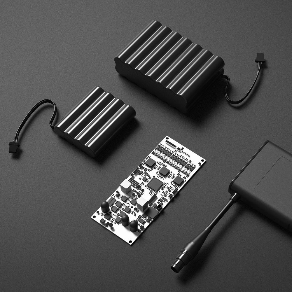 A bunch of Friwo power supplies are laying on a black surface