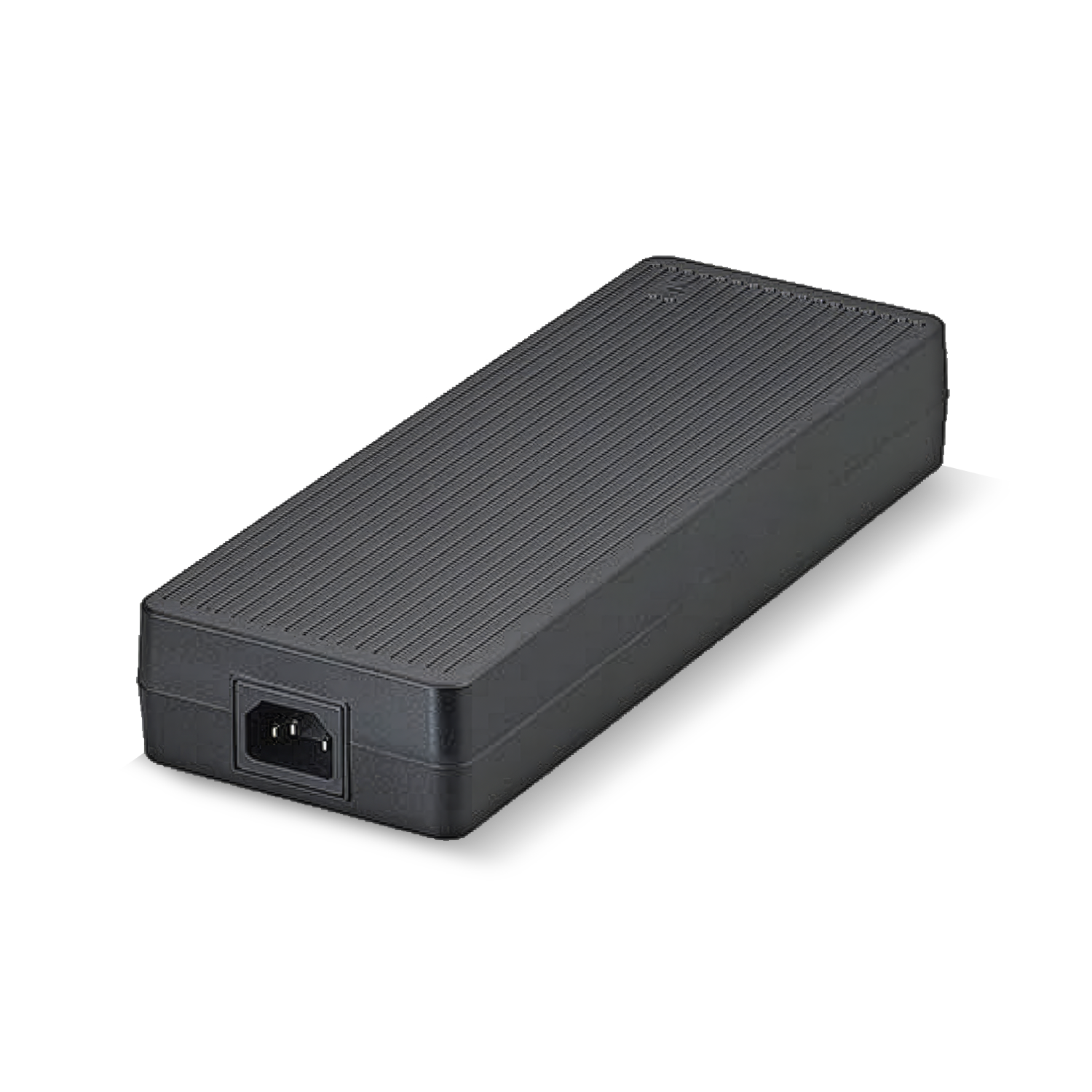 A black power supply is sitting on a white surface