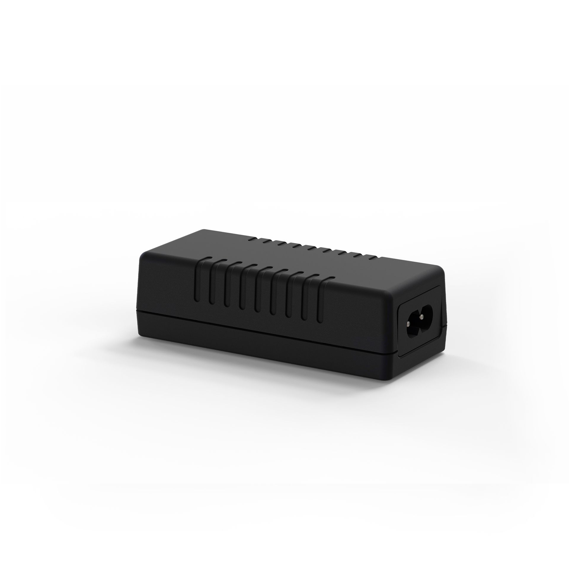 A black power supply is sitting on a white surface